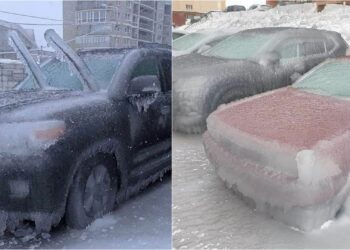 Ngrin qyteti, njerëzit me çekiç thyejnë akullin për të lëvizur me makina